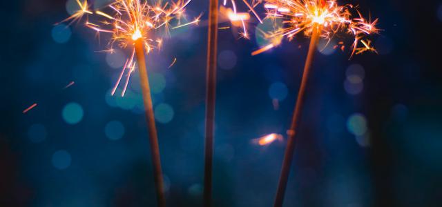 three sparkler sticks by Tim Zänkert courtesy of Unsplash.